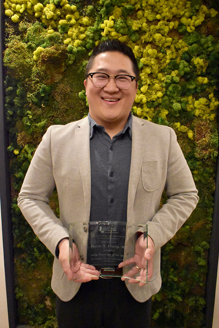 Dr. Chang with his award plaque